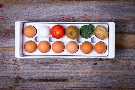 Conceptual image showing ways to manage food in the refrigerator with a plastic egg trayの写真素材
