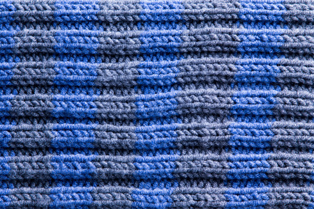 Close up Homemade Crochet in Blue and Gray Colors with Horizontal Pattern of Ridge Lines. Can be...
