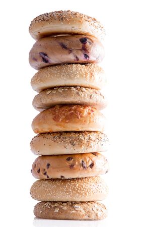 Close up Tasty Homemade Bagel Breads Piled Vertically, Isolated on a White Background.の写真素材