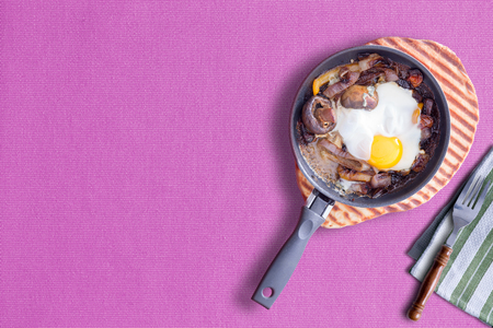 Sunny Side up Omelette on Violet Color Table Cloth, Copy Space at Leftの写真素材
