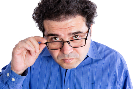 Close up Middle Aged Businessman with Reading Eyeglasses Looking at the Camera Seriously, Isolated on White Background.の写真素材