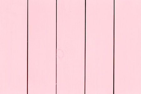 Rose pink stained wood background texture and parallel pattern in a full frame view with copy space for your creative or architectural themeの写真素材
