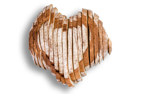 High quality sliced bread in shape of heart over white background for Valentines Day or love conceptの写真素材
