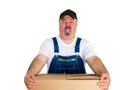 Deliverer carrying heavy cardboard package against white backgroundの写真素材