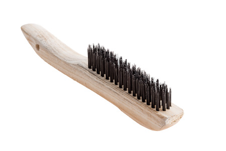 Close up view of wooden cleaning brush against white backgroundの写真素材