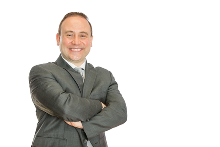 A portrait of a happy, delighted business man with folded arms on a white  with copy space.の写真素材