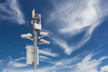 Security camera on the sky background