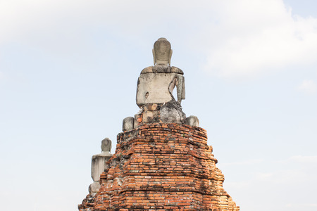 ancient buddha sandstone statues on blue sky backgroundの写真素材