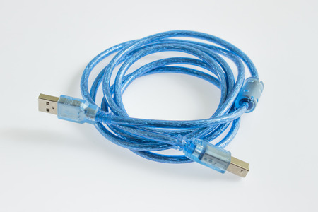 Blue USB cables connecting computerの写真素材