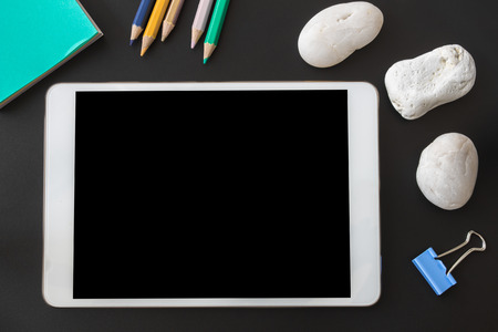 Blank smart phone on a dark table in the officeの写真素材