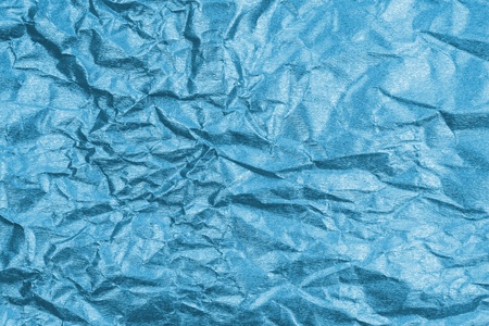 Texture crease of blue paper for template wallpaper. wrinkle of paper crumpled background.の写真素材