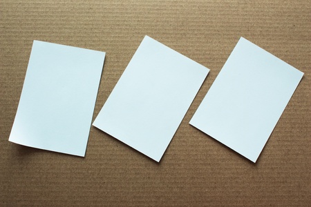 Blank portrait mock-up paper. brochure magazine isolated on brown background, changeable background / white paper template isolatedの写真素材