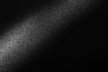 black paper texture or background with spotlight, dark wall backdrop wallpaper, dark tone.の写真素材