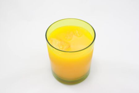 cool orange juice with ice in a cupの写真素材