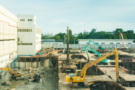 Construction a building in urban by man and machineのeditorial素材