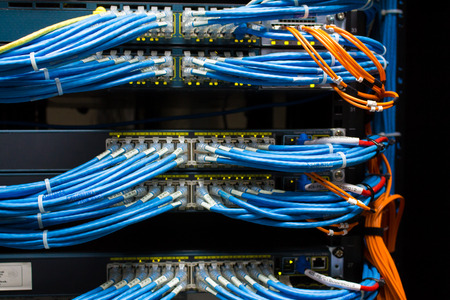front side of working data servers with flashing LED lightsの写真素材