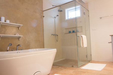 Empty bathroom with loft wall style, bath tub,shower and toiletの写真素材