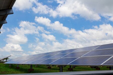 Solar panel tracking system with blue sky and very cloud day.の写真素材