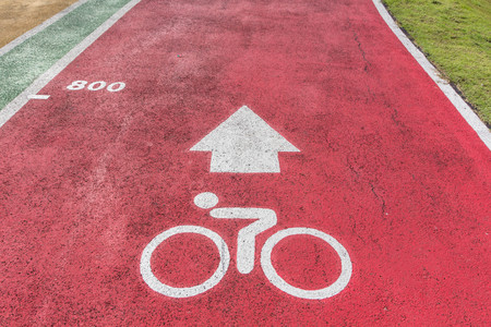 White lines of stadium and texture of running racetrack red rubber racetracks in outdoor stadium, ride bicycle.の写真素材