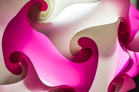 Some of the plastic is cut into curved plates and then stacked to make a lamp that looks beautiful art.の写真素材