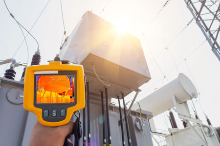 Thermoscan(thermal image camera), Industrial equipment used for checking the internal temperature of the machine for preventive maintenance, This is checking The Transformer.の写真素材