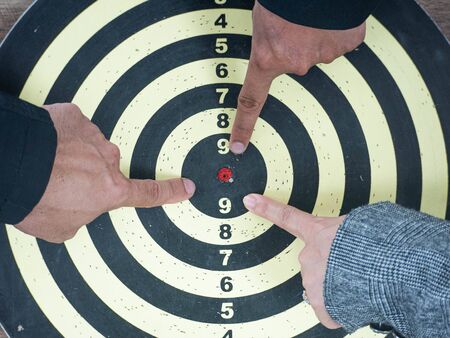 Businessman group point to a darts aiming at the target center, Target marketing and business...