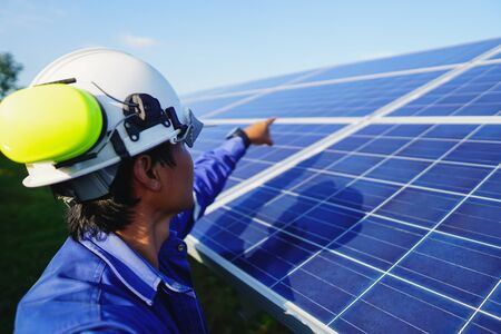 Engineering is checking the accuracy of the solar panel system installation, alternative electricity...