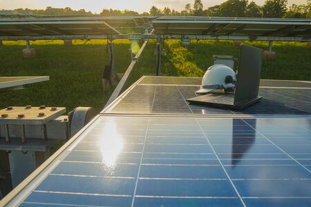 The white safety helmet and labtop of the engineer who examined the operation of the electrical...