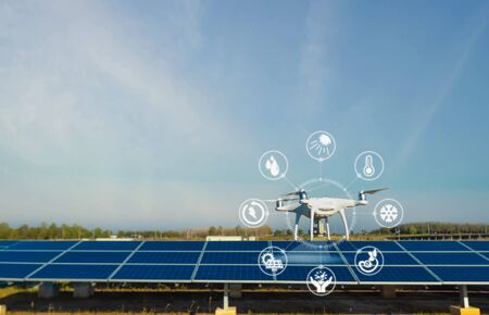 Engineers use the infrared scanner is installed on the drone to check the heat, humidity, irradiance to analyze to make sure the system is working at full efficiency.の写真素材