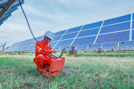 Engineers used a tool for checking the performance of the solar panel to confirming systems working normally. Photovoltaic module idea for clean energy production.の写真素材