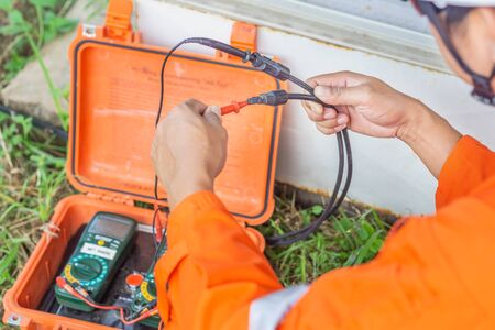 Engineers used a tool for checking the performance of the solar panel to confirming systems working normally. Photovoltaic module idea for clean energy production.の写真素材