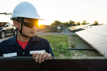 Technicians prepare solar panels for installation in the solar plant, Alternative energy to conserve the world's energy, Photovoltaic module idea for clean energy production.の写真素材