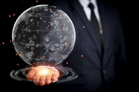 The businessman reached out with a 3D globe in his hand. concept to the search for clean energy to reduce the generation of energy that destroys the world, Like the word save word save life.の写真素材