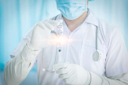 close up doctor holding syringe to injection to the patient in medical. Covid-19 or coronavirus vaccine. virus removal and prevention concept.の写真素材