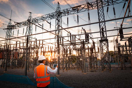 Engineers are checking the operation of the system by laptop, weekly check the system of the power...