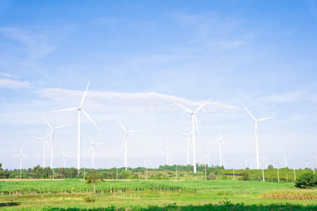 Wind turbines of global ecology with cloud background on the sky. alternative electricity source to...