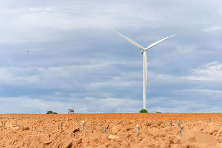 Wind turbines of global ecology with cloud background on the sky. alternative electricity source to...