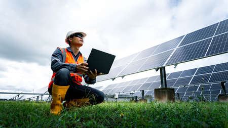 The solar farm(solar panel) with engineers check the operation of the system, Alternative energy to...