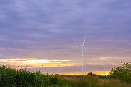 Wind turbines of global ecology with cloud background on the sky. alternative electricity source to...