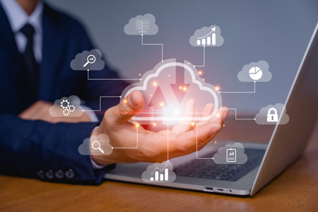 Hand of a businessman and big data analytics and business intelligence concept with chart and graph...