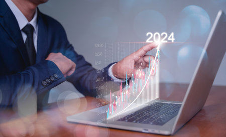 Businessman analysingforex trading graph financial data. 2024 business finance technology and...