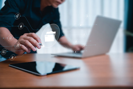 Businessman use laptop for document management system online document database and automated processes in file management search and manage document database files on internet. Bigdata. DMS.の写真素材