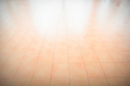 Tiled floor marble yellow vignette ideal for a background and used in interior design.の写真素材