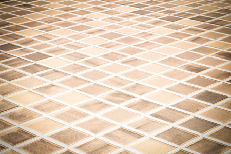 Tiled floor marble yellow vignette ideal for a background and used in interior design.の写真素材