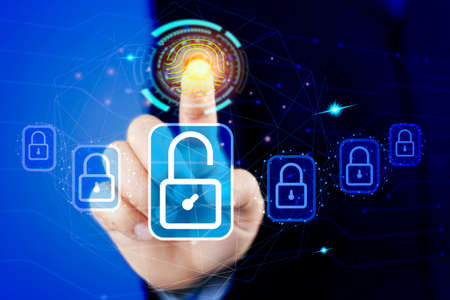 Cybersecurity Concept to protect Information on Internet Network. Businessman Scan fingerprint with virtual screen interface to enter Internet Network.Futuristic virtual screen interface Technology.の写真素材
