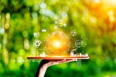 green energy concept help reduce global warming.Hand holding natural background light bulb on green leaf with clean energy icon around it. Carbon dioxide emission in industry zero carbon concept.の写真素材