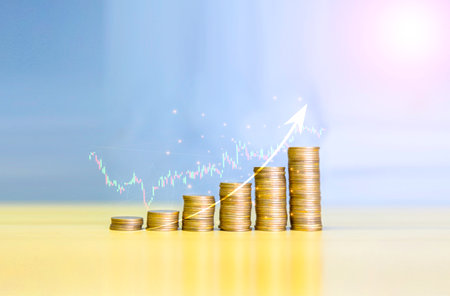 Gold coins chart an increase inflation.financial graph showing inflation concept. Displays stock...