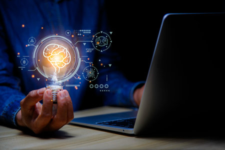 Light bulb in hand businessman. Idea Success with Innovation, Artificial Intelligence technology. AI technology Machine learning data analysis and management, Futuristic technology transformation.の写真素材