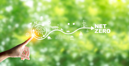 Businessman points at Carbon neutrality icon, Green Energy Renewable Sustainable concept. Net zero...