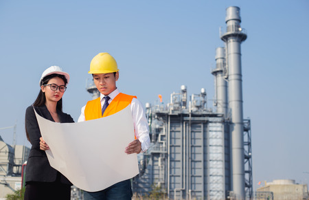woman engineer and men engineer working new project in power plantの写真素材